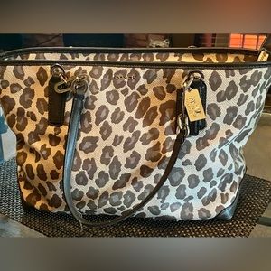 Women Coach Leopard print satchel purse.